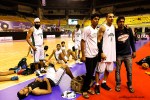 T.J. Sahi and fans watch the monitor while the Punjab team relaxes after their Semi-final win at the Senior National Basketball Tournament in Chennai, India&nbsp;2011